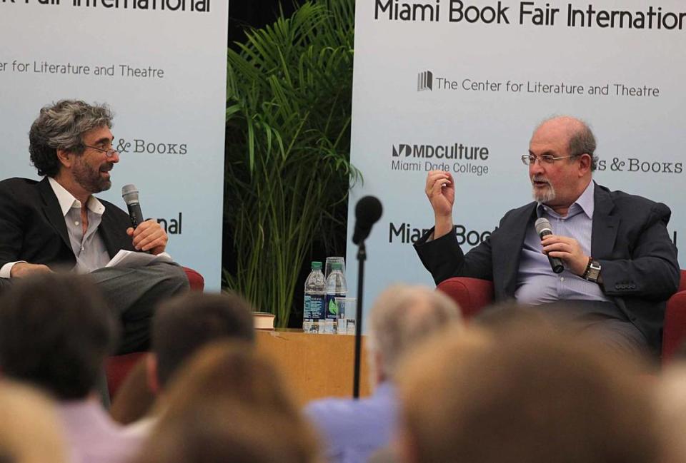 Mitch Kaplan (left), chats with best selling author Salman Rushdie, during a presentation of his book “Joseph Anton” in 2013.