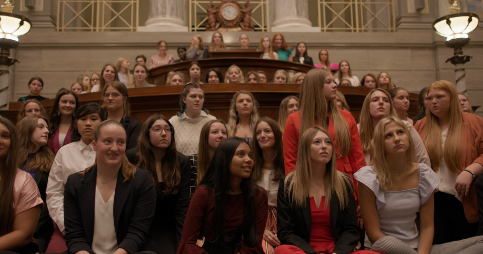 the participants gathered for girls state assembly in the documentary film girls state