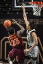 Virginia Tech guard Tyrece Radford (23) shoots under defense from Wake Forest guard Jalen Johnson (2) during an NCAA college basketball game Sunday, Jan. 17, 2021, in Winston-Salem, N.C. (Andrew Dye/The Winston-Salem Journal via AP)