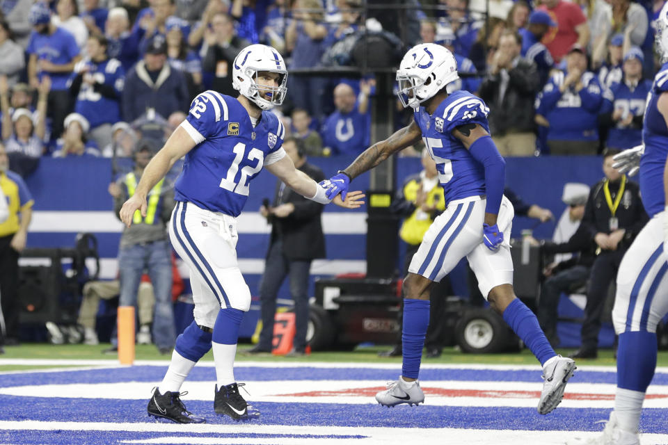 Indianapolis Colts quarterback Andrew Luck (12) and wide receiver Dontrelle Inman (15) celebrate after a touchdown by running back Marlon Mack (25) against the New York Giants during the second half of an NFL football game in Indianapolis, Sunday, Dec. 23, 2018. (AP Photo/AJ Mast)