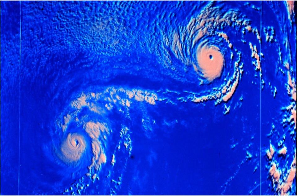 An example of the Fujiwhara effect occurred in 1974, when  Hurricanes Ione and Kirsten spun about each other in the eastern Pacific. This satellite image shows Ione on the left and Kirsten on the right.