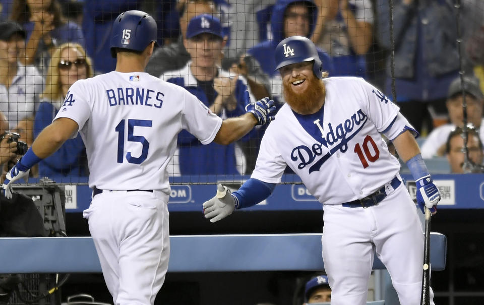 Los Angeles Dodgers’ Austin Barnes,left, is congratulated by Justin Turner for his two-run home run during the fourth inning of a baseball game against the New York Mets on Tuesday, Sept. 4, 2018, in Los Angeles. (AP Photo/John McCoy)