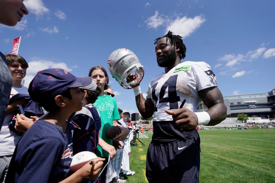 New England Patriots player Ty Montgomery signs autographs following an NFL football team training camp, Wednesday, Aug. 3, 2022, in Foxborough, Mass.