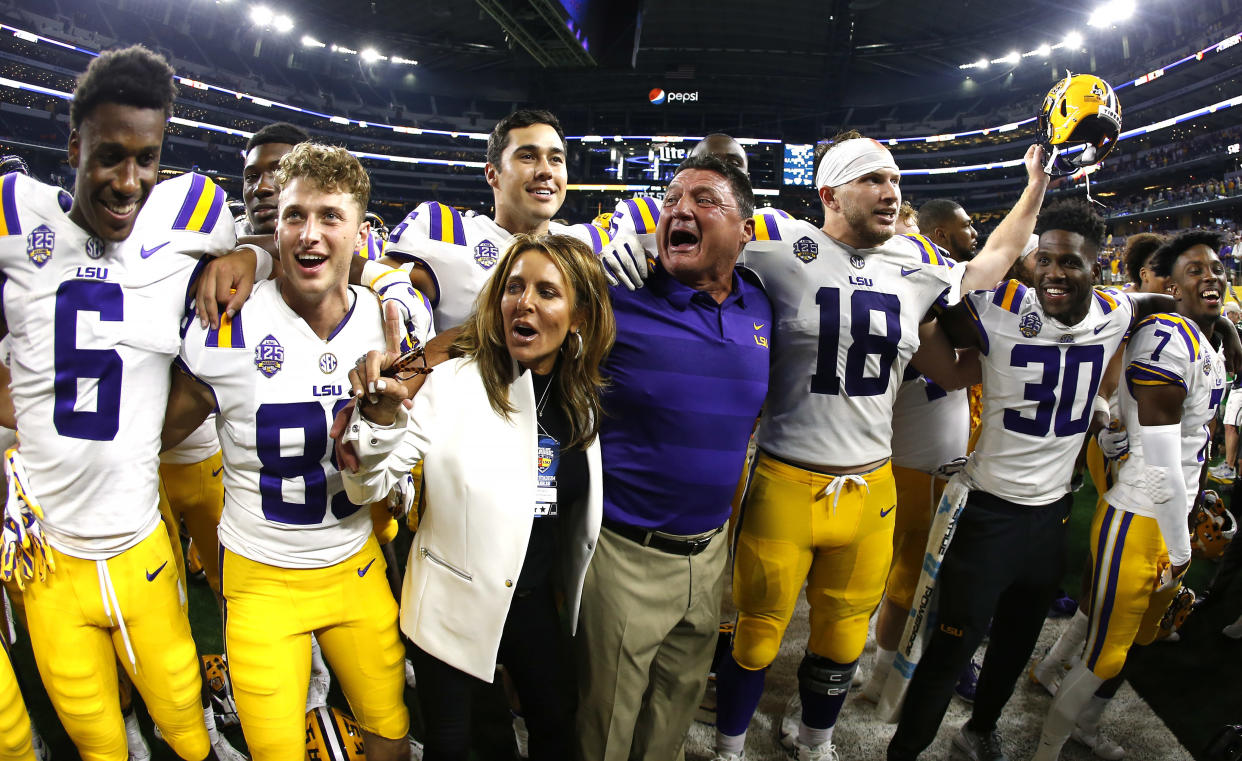 LSU coach Ed Orgeron celebrates with his team following a 33-17 win over Miami in an NCAA college football game Sunday, Sept. 2, 2018, in Arlington, Texas. (AP Photo/Ron Jenkins)