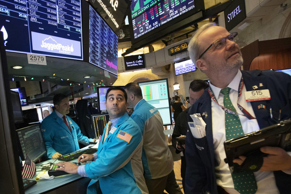 FILE - In this Dec. 11, 2018, file photo, William Geier Jr., left, and David O'Day work at the New York Stock Exchange in New York. No matter which way the stock market goes in 2019, and Wall Street has ample arguments for either direction, expect it to be another gut-wrenching ride. (AP Photo/Mark Lennihan, File)