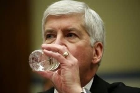 Michigan Governor Rick Snyder drinks some water as he testifies before a House Oversight and government Reform hearing on "Examining Federal Administration of the Safe Drinking Water Act in Flint, Michigan, Part III" on Capitol Hill in Washington March 17, 2016. REUTERS/Kevin Lamarque