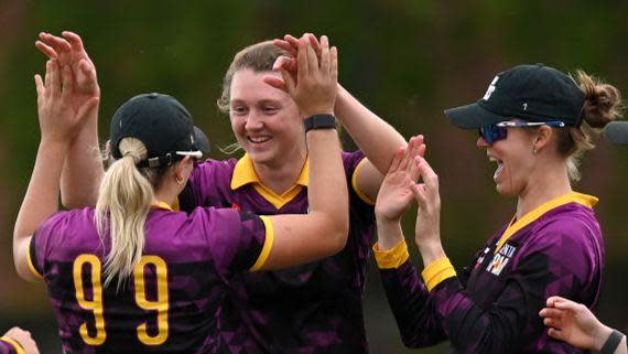 Central Sparks' Grace Potts celebrates taking a wicket with team-mates