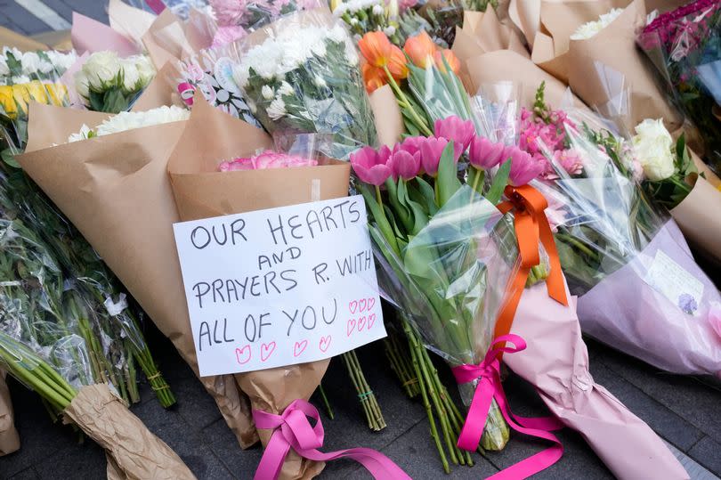 Tributes left near the scene at Bondi Junction -Credit:Rick Rycroft/PA