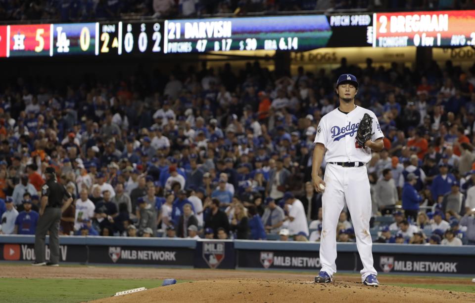 Los Angeles Dodgers’ Yu Darvish reacts after giving up a two-run home run toHouston Astros’ George Springer during the second inning of Game 7 of baseball’s World Series Wednesday, Nov. 1, 2017, in Los Angeles. (AP Photo/Matt Slocum)