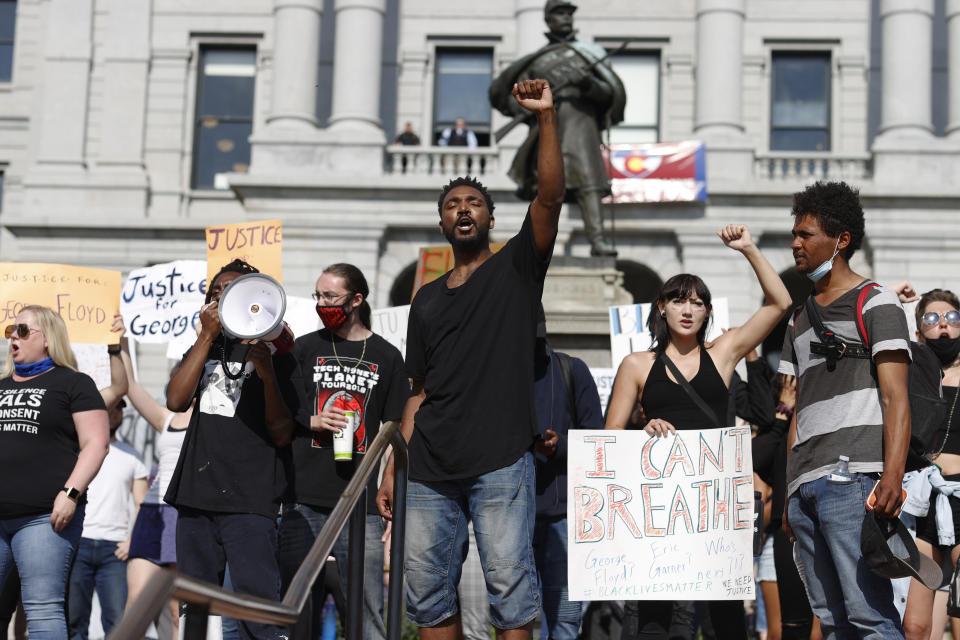 Javon Block leads a chant during a protest outside the State Capitol over the death of George Floyd, a handcuffed black man in police custody in Minneapolis, Thursday, May 28, 2020, in Denver. Close to 1,000 protesters walked from the Capitol down the 16th Street pedestrian mall during the protest. (AP Photo/David Zalubowski)