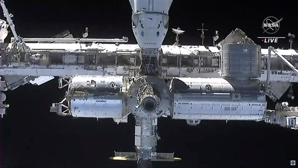 This image made from NASA TV shows the international space station, seen from the SpaceX Crew Dragon spacecraft Saturday, April 24, 2021.