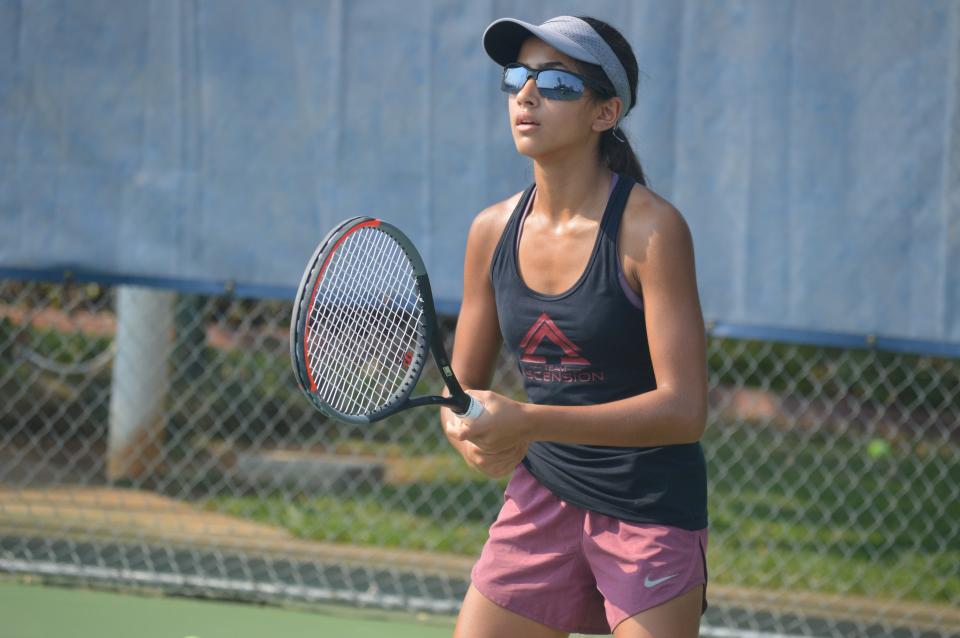 Shasta High School freshman Aria del Rosario-Sabet gets ready to receive a serve during a practice with Team Ascension at Sun Oaks Tennis & Fitness on Aug. 27, 2020.