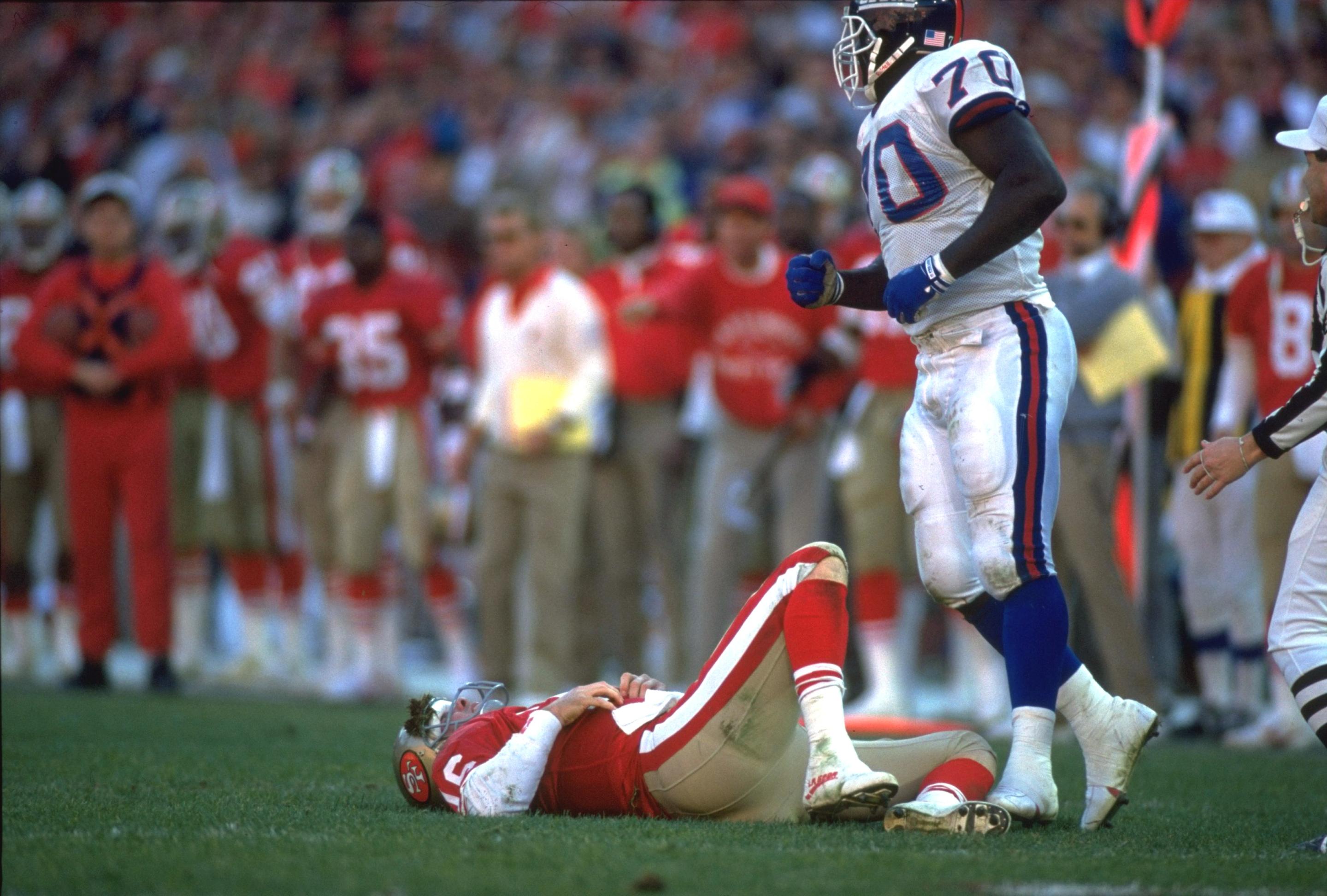 UNITED STATES - JANUARY 20:  Football: NFC playoffs, San Francisco 49ers QB Joe Montana on ground with injury during game vs New York Giants, San Francisco, CA 1/20/1991  (Photo by Richard Mackson/Sports Illustrated via Getty Images)  (SetNumber: X40924)