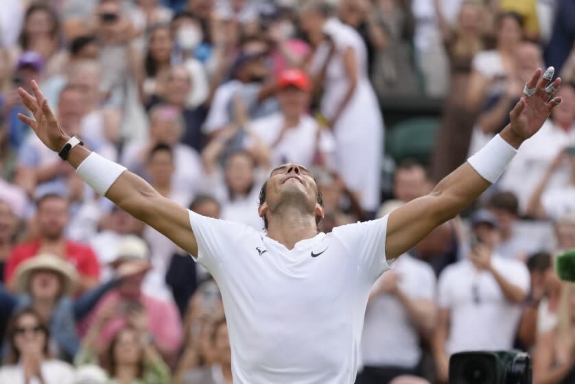 Spain's Rafael Nadal celebrates after beating Taylor Fritz of the US in a men's singles quarterfinal match at Wimbledon