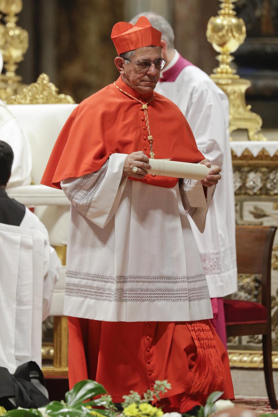 Newly elevated Cardinal Juan de la Caridad Garcia Rodriguez walks during a consistory inside St. Peter's Basilica, at the Vatican, Saturday, Oct. 5, 2019. Pope Francis has chosen 13 men he admires and whose sympathies align with his to become the Catholic Church's newest cardinals. (AP Photo/Andrew Medichini)