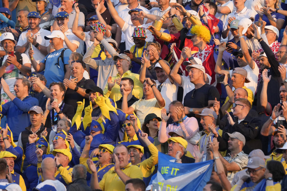 Fans wait in the stands for the start of the first morning Foursome match on the 1st tee at the Ryder Cup golf tournament at the Marco Simone Golf Club in Guidonia Montecelio, Italy, Friday, Sept. 29, 2023. (AP Photo/Andrew Medichini)