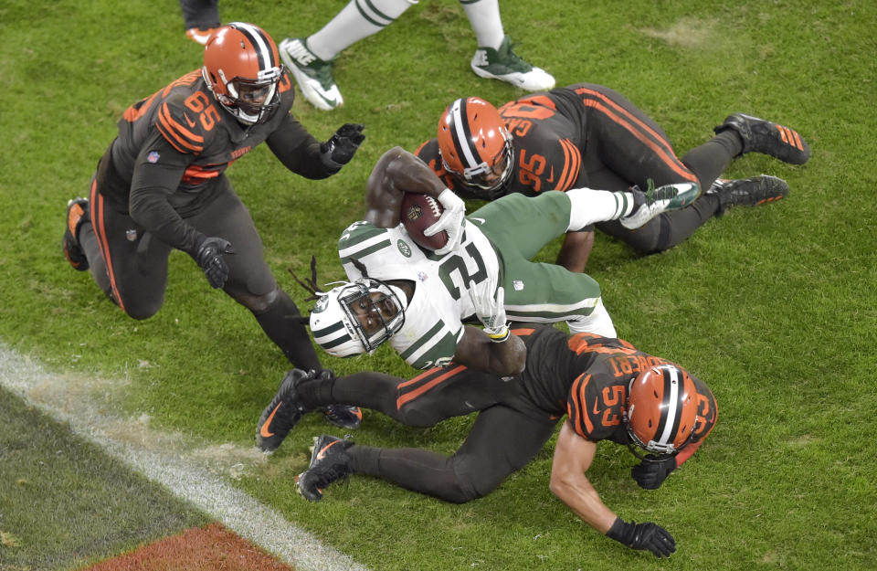 New York Jets running back Isaiah Crowell (20) scores a 2-yard touchdown during the first half of an NFL football game against the Cleveland Browns, Thursday, Sept. 20, 2018, in Cleveland. (AP Photo/David Richard)