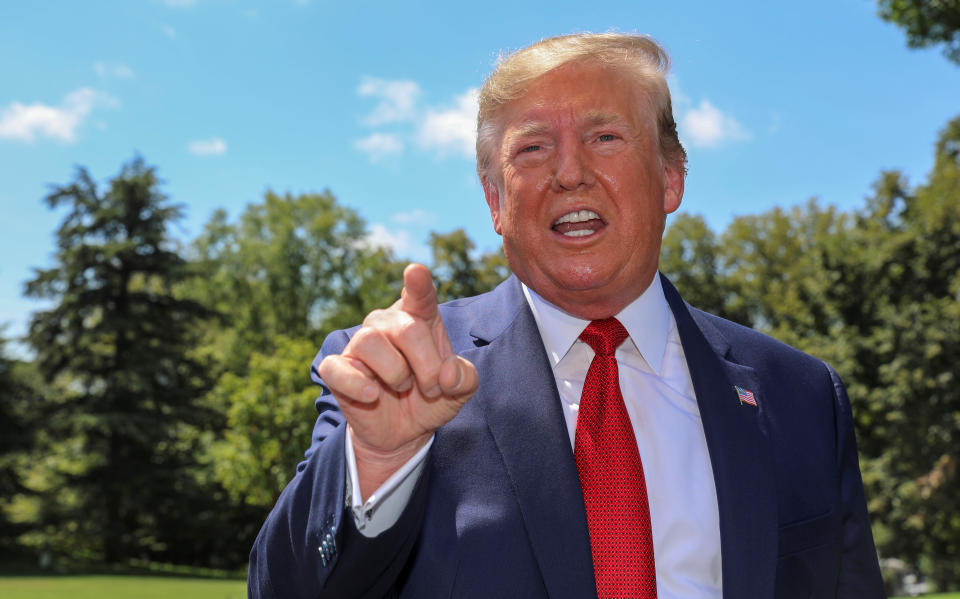 U.S. President Donald Trump speaks to reporters as he departs for travel to the AMVETS convention in Kentucky from the South Lawn of the White House in Washington, U.S. August 21, 2019. REUTERS/Tasos Katopodis