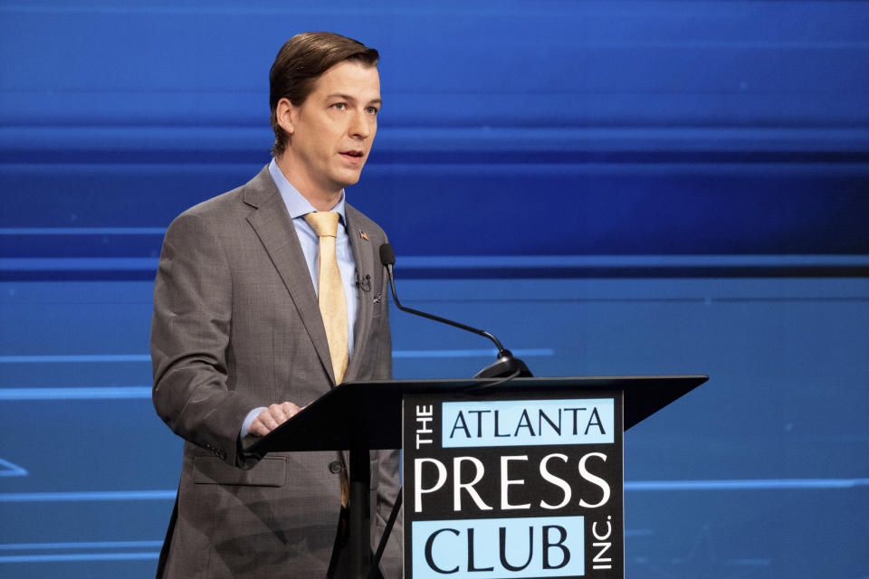 Libertarian challenger Chase Oliver speaks at a U.S. Senate debate with U.S. Sen. Raphael Warnock, D-Ga., during the Atlanta Press Club Loudermilk-Young Debate Series in Atlanta on Sunday, Oct. 16, 2022. Republican challenger Herschel Walker was invited but did not attend. (AP Photo/Ben Gray)