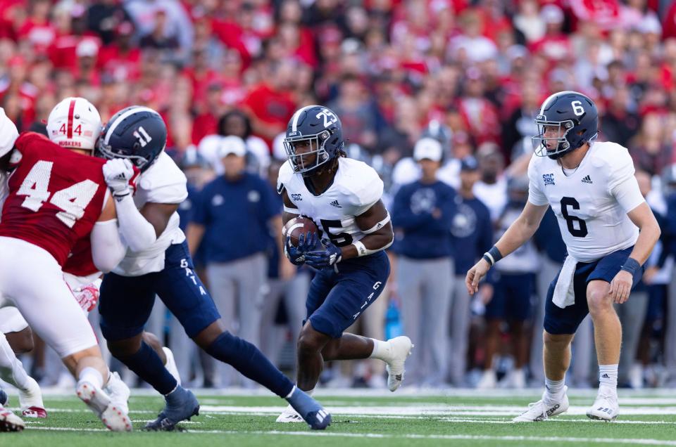 Georgia Southern running back Jalen White (25) carries the ball following a handoff from quarterback Kyle Vantrease (6) against Nebraska on Sept. 10, 2022, in Lincoln, Nebraska. White suffered a leg injury last week against Marshall and could miss the game this Saturday against Appalachian State.