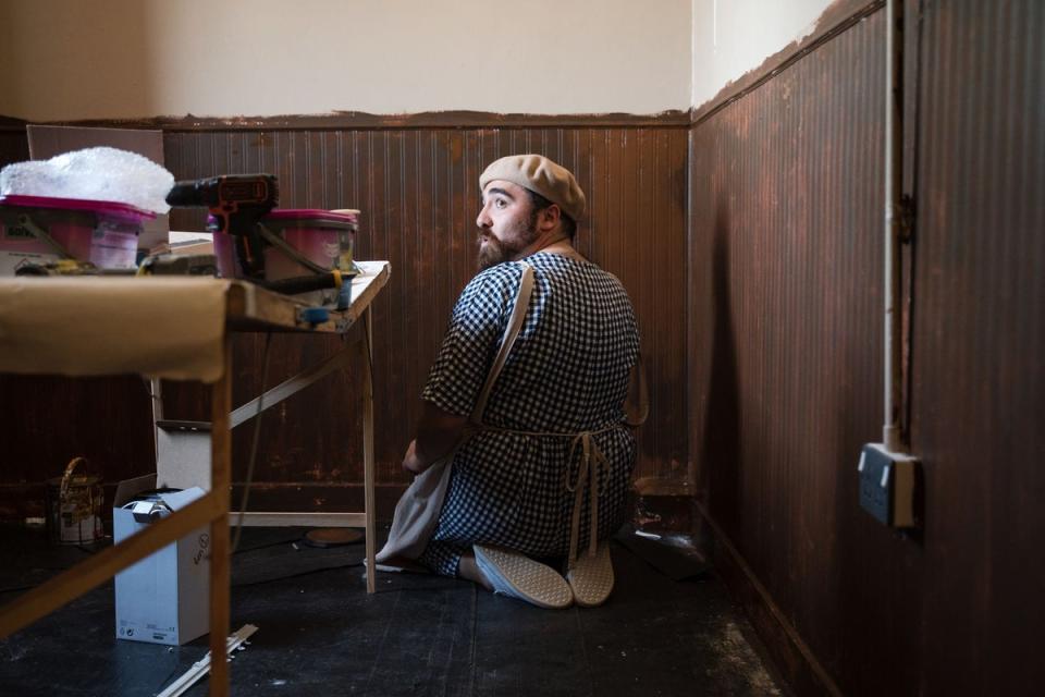 Ben installs faux wood panelling in his nun’s cell (BBC / Darlow Smithson Productions)