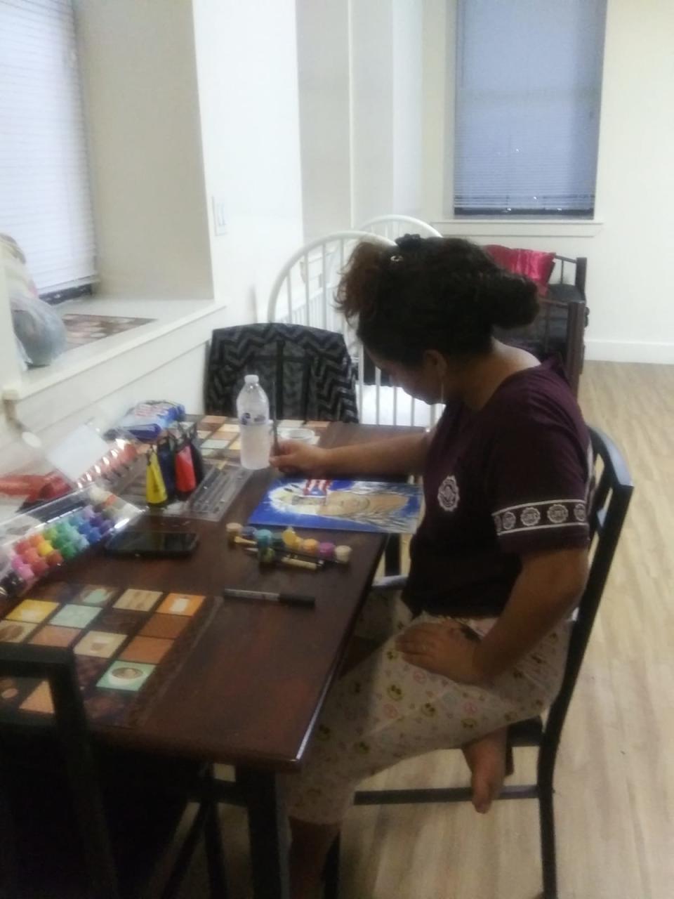 Jennyfer's daughter, 14, painting at the table in their room at the Bronx shelter&nbsp;&nbsp; (Photo: Jennyfer Ortiz)