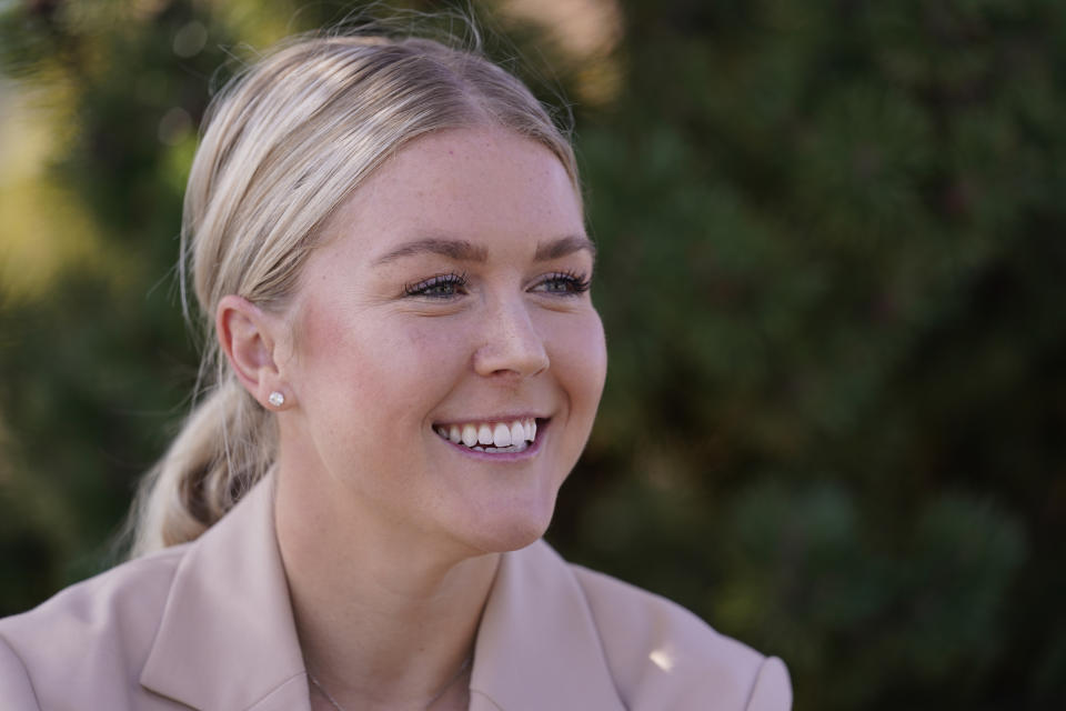 New Hampshire Republican 1st Congressional District candidate Karoline Leavitt smiles during an interview after a campaign event, Thursday, Sept. 29, 2022, in Manchester, N.H. Leavitt is facing incumbent Sen. Chris Pappas in the general election. (AP Photo/Charles Krupa, File)