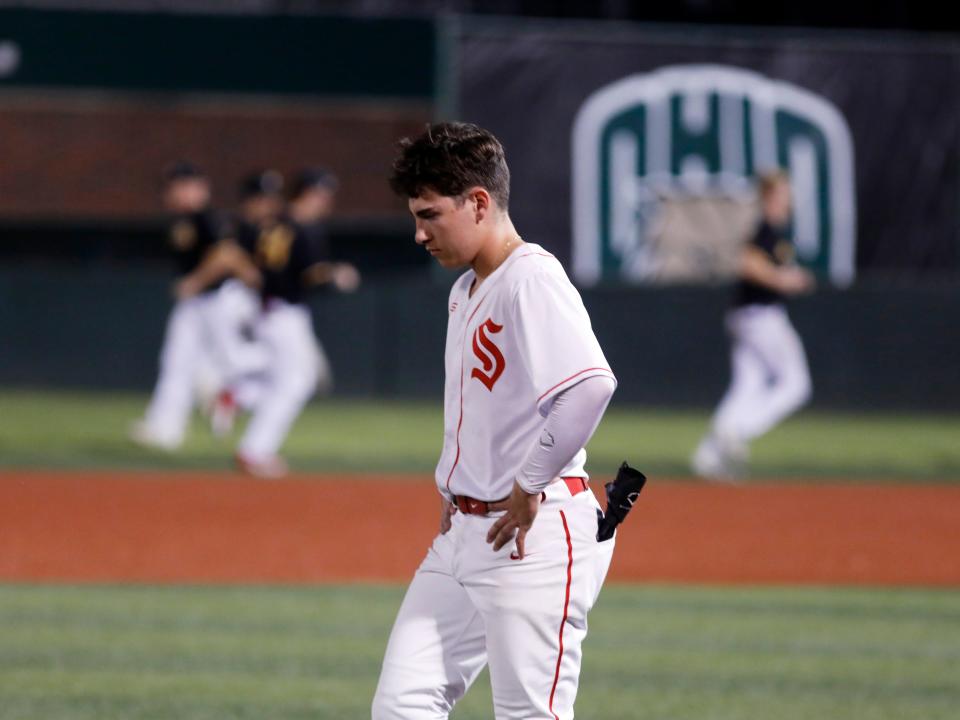 Senior Monty Eden walks off the field following Sheridan's 3-1 loss to Washington Court House Miami Trace during a Division II district semifinal at Bob Wren Stadium in Athens. Sheridan finished a 24-4 season.