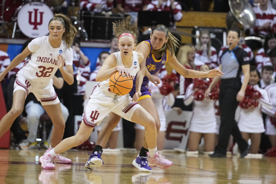 Indiana's Grace Berger, left, makes a steal against Tennessee Tech's Anna Walker during the first half of a first-round college basketball game in the women's NCAA Tournament Saturday, March 18, 2023, in Bloomington, Ind. (AP Photo/Darron Cummings)