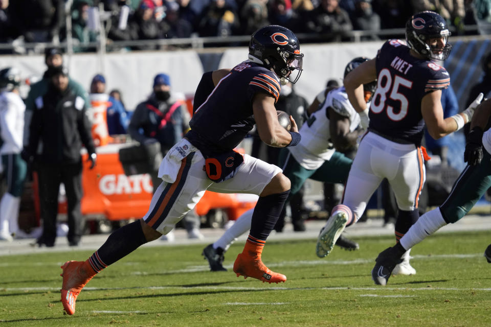 Chicago Bears' Justin Fields runs during the first half of an NFL football game against the Philadelphia Eagles, Sunday, Dec. 18, 2022, in Chicago. (AP Photo/Nam Y. Huh)