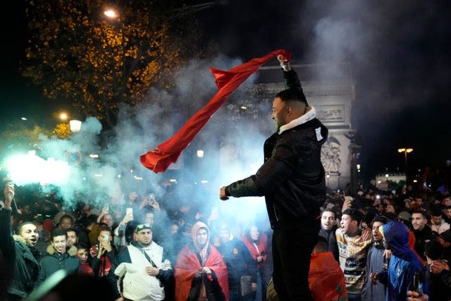 Morocco fans in Paris celebrate their team's victory