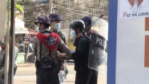 FILE - In this file image made from video taken on Feb. 27, 2021, Associated Press journalist Thein Zaw is arrested by police in Yangon, Myanmar. The government has detained dozens of journalists since the Feb. 1 coup, including Thein Zaw of The Associated Press. But local media are fighting back using other methods to provide news updates, such as social media platforms. (AP Photo/File)