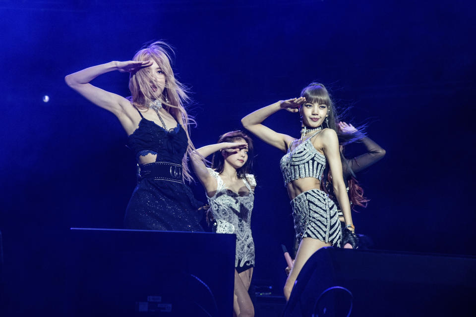 FILE - Rose, from left, Jenni Kim, and Lisa of Blackpink perform at the Coachella Music & Arts Festival in Indio, Calif. on April 12, 2019. The band releases "The Album" on Friday. (Photo by Amy Harris/Invision/AP, File)