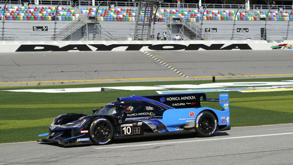 The Konica Minolta Acura DPi heads down pit road to take part in a practice session for the Rolex 24 hour race at Daytona International Speedway, Friday, Jan. 29, 2021, in Daytona Beach, Fla. (AP Photo/John Raoux)