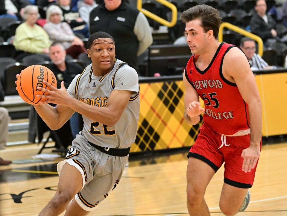 The College of Wooster's Jamir Billings slashes against Edgewood. He finished with 22 points.