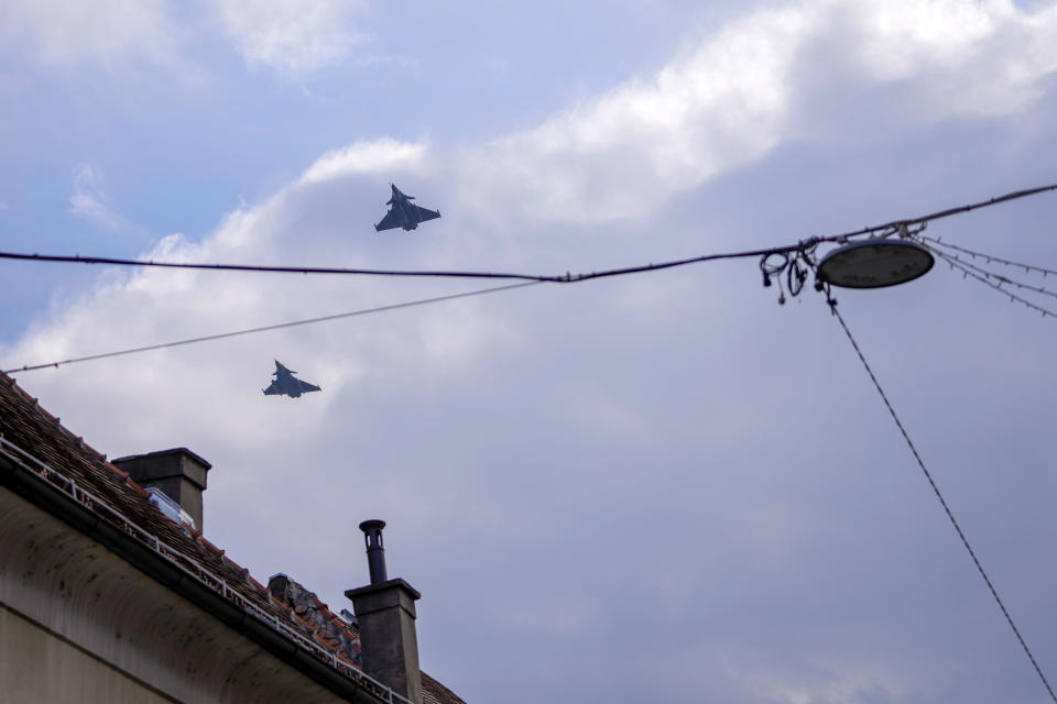 FILE - Two Dassault Rafale fighter jets fly after a signing ceremony between French President Emmanuel Macron and Croatia's Prime Minister Andrej Plenkovic in Zagreb, Croatia, Thursday, Nov. 25, 2021. Serbia is close to signing a deal on the purchase of 12 French Rafale multi-purpose fighter jets, the Serbian president announced Tuesday, April 9, 2024, in what would mark a shift from its traditional military supplier Russia. President Aleksandar Vucic spoke during his two-day visit to Paris and talks with French President Emmanuel Macron as well as French defense officials including Rafale manufacturer Dassault Aviation. (AP Photo/Darko Vojinovic, File)