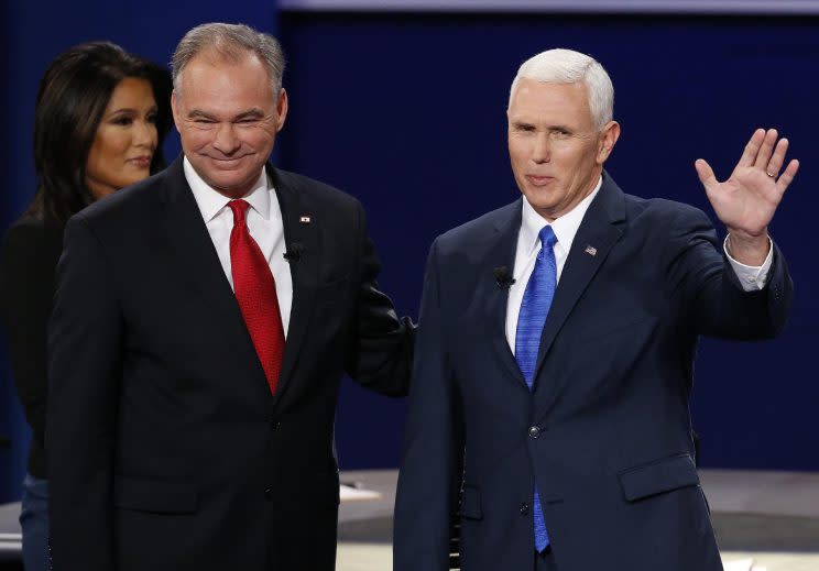 Gov. Mike Pence, right, and Sen. Tim Kaine stand before the audience during the vice-presidential debate at Longwood University in Farmville, Va. (Photo: Steve Helber/AP)