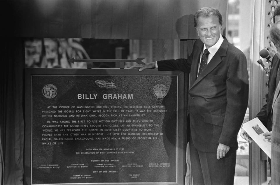 Graham unveils the plaque commemorating the site of his first crusade that launched his career. At the ceremonies, he preached part of the same sermon that he gave in 1949, warning that America must repent of its sins or face the judgement of God.