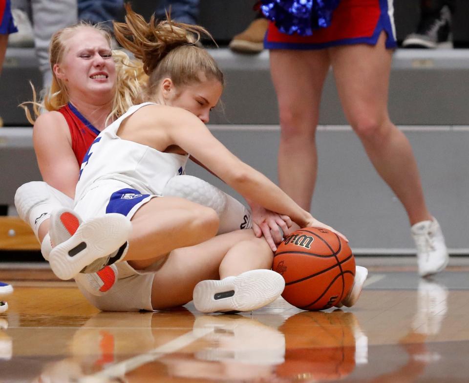 Indian Creek Faith Wiseman (22) and Bishop Chatard Grace Felts (15) fight for possession during the IHSAA Girls Basketball Regional 7 Final, Saturday, Feb. 11, 2022, at McAnally Center in Greencastle, Ind. 