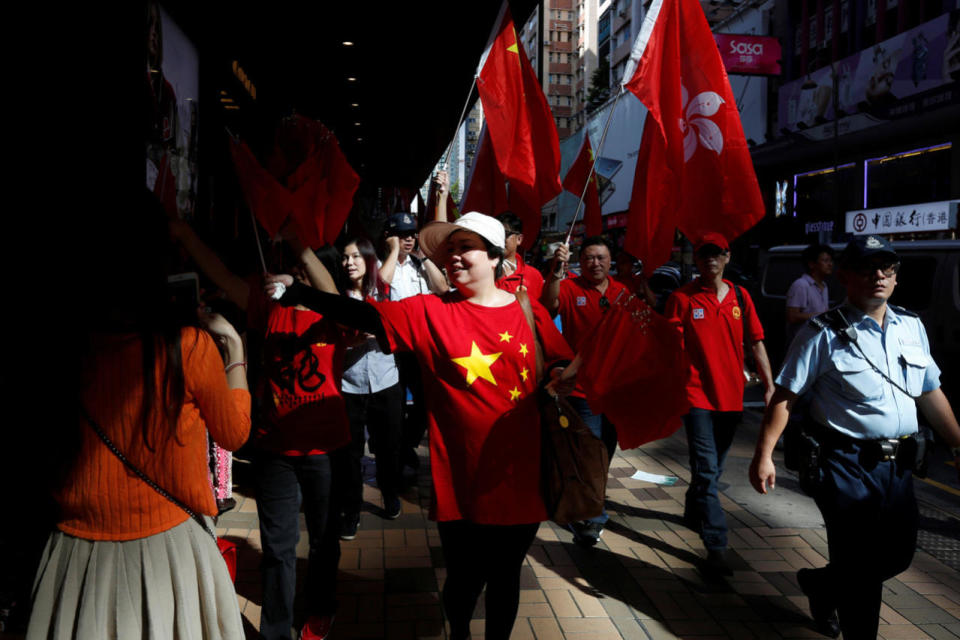 Pro-China supporters march to celebrate China’s National Day in Hong Kong