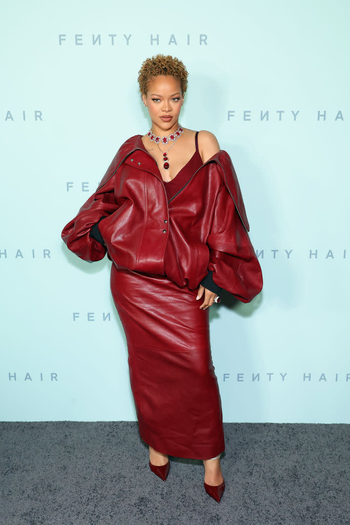 Rihanna attends the Fenty Hair launch party on June 10 in Los Angeles, curly cropped hair, red leather outfit