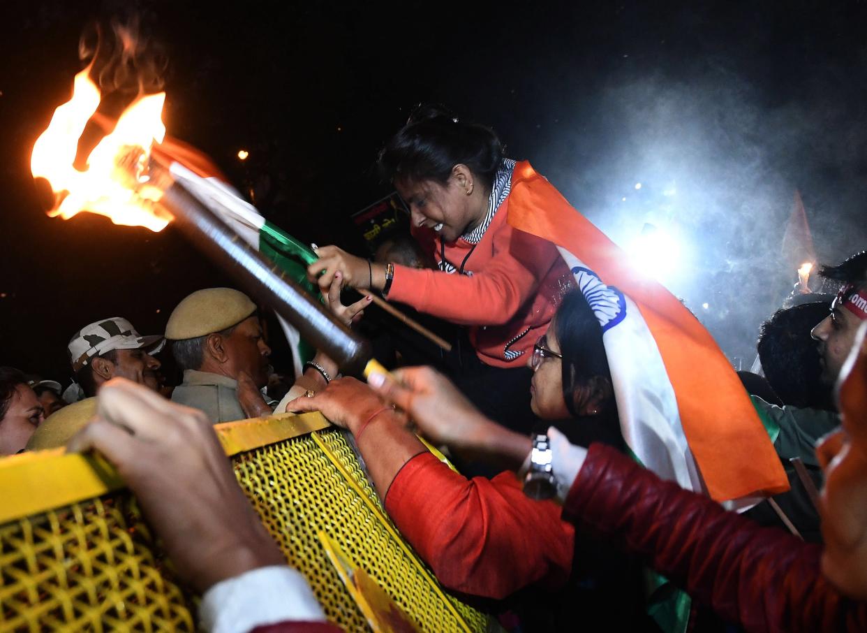 <p>File image: Indian women rights activists try to break Police barricades during a candle light march in December 2019 in New Delhi to denounce violence against women</p> (EPA)