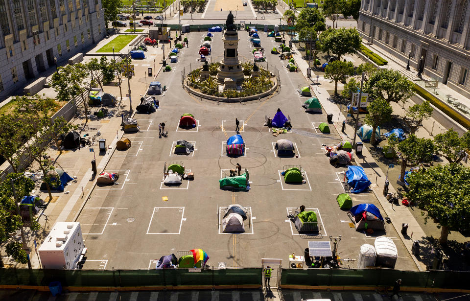 Rectangles designed to help prevent the spread of the coronavirus by encouraging social distancing line a city-sanctioned homeless encampment at San Francisco's Civic Center on May 21<span class="copyright">Noah Berger—AP</span>