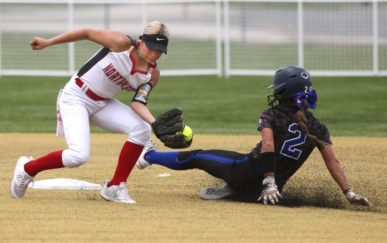 Coventry's Lexi Dimeff slides in safely at second ahead of the tag by NorthWest shortstop Kelsi DeFrank on Tuesday, May 16, 2023 in Canton, Ohio, in a Division II District semi-final game at Willig Softball Complex.