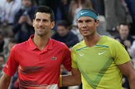 FILE - Serbia's Novak Djokovic, left, and Spain's Rafael Nadal pose ahead of their quarterfinal match at the French Open tennis tournament in Paris, France, Tuesday, May 31, 2022. The Australian Open tennis tournament begins Monday, Jan. 16, 2023. Nadal is the defending champion and who owns a men’s-record 22 majors. It is Djokovic, though, who will draw the most attention. (AP Photo/Christophe Ena, File)