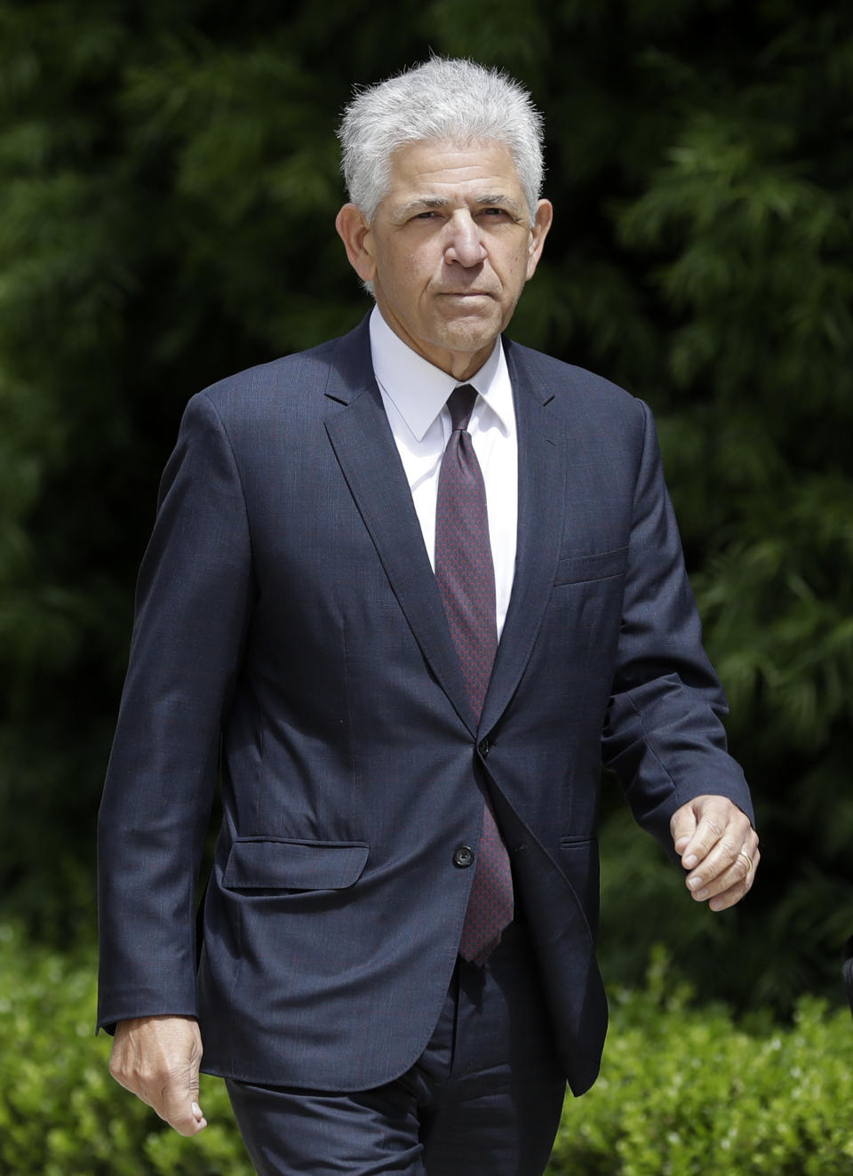 Daniel Petrocelli, lead attorney for President Donald Trump, arrives to the courthouse before a hearing Thursday, March 30, 2017, in San Diego. A judge said Thursday he will issue a ruling at a later time on whether to accept an agreement for President Trump to pay $25 million to settle lawsuits over his now-defunct Trump University. (AP Photo/Gregory Bull)