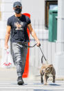 <p>Justin Theroux takes his pup Kuma out for a walk to enjoy the spring weather on Wednesday in N.Y.C.</p>