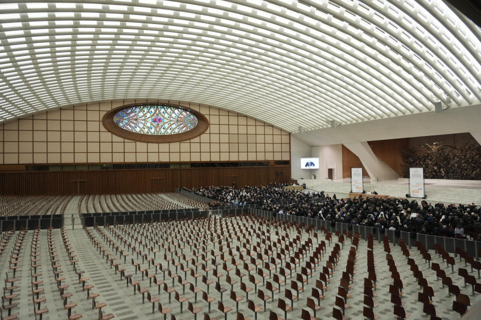 Faithful gather in the Paul VI hall to attend the opening of a 3-day Symposium on Vocations in the Paul VI hall at the Vatican, Thursday, Feb. 17, 2022. (AP Photo/Gregorio Borgia)