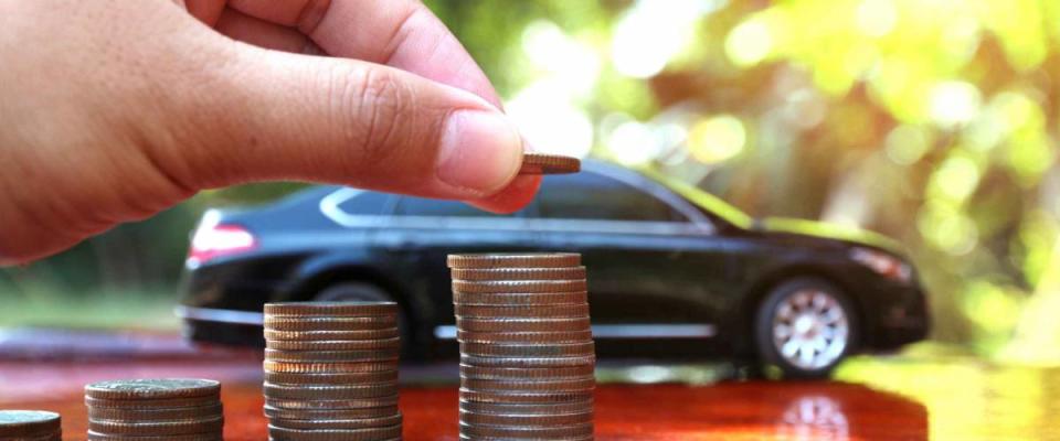 Car model and Financial statement with coins, finance and loan concept, saving money