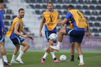 England's Harry Kane, middle, takes part in drills during an official training session on the eve of the quarterfinal World Cup soccer match between France and England, at Al Wakrah Sports Complex, in Al Wakrah, Qatar, Friday, Dec. 9, 2022. (AP Photo/Abbie Parr)